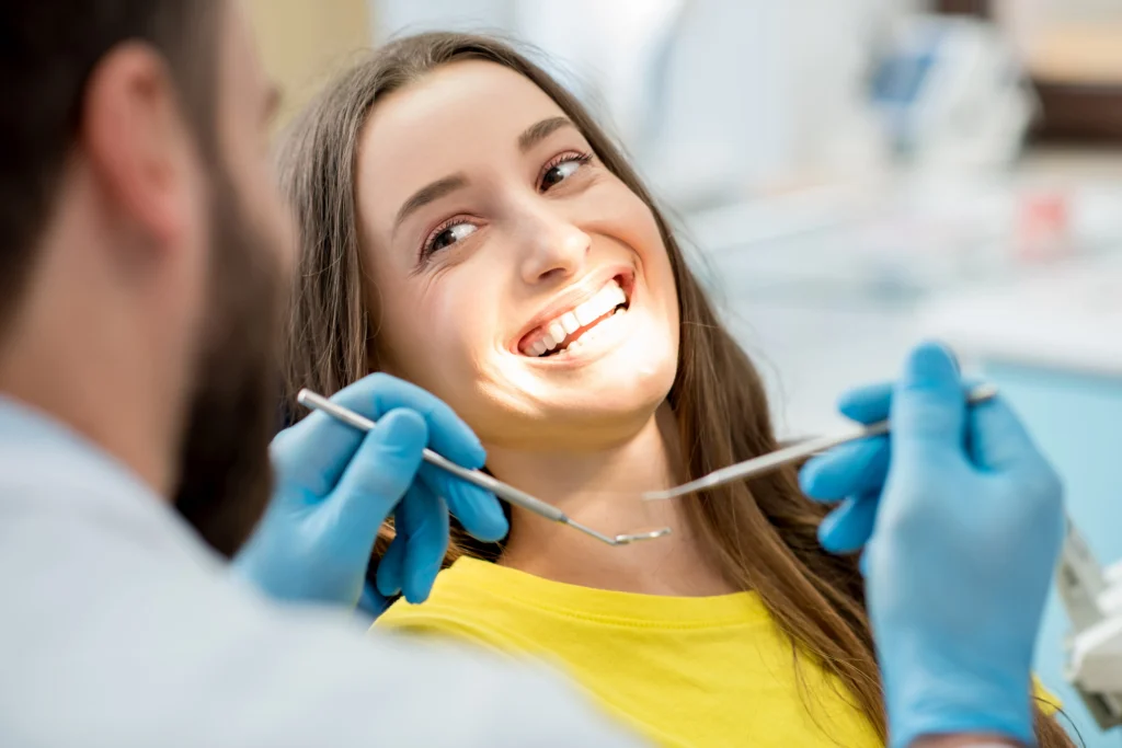 Dental patient smiling while receiving treatment at The Smile Spot